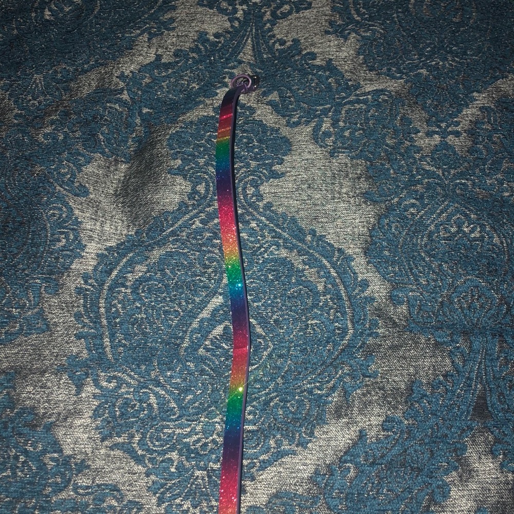 Girls adjustable rainbow, purple, and gold belts